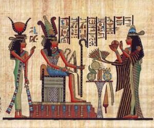 One of the maids proffers offerings to the king Ramses ii and his pretty wife Nefertiti, who is shown here standing at the back of her husband's chair